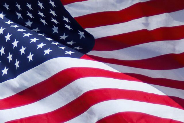 photo - US Flag Waving in the Wind