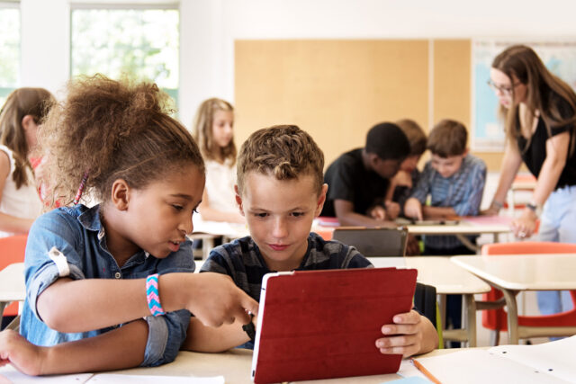 photo - Elementary Students at Desks in Classroom