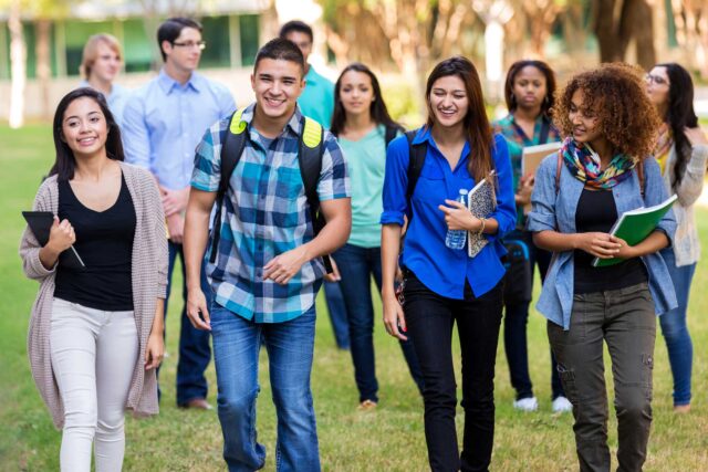 photo - Diverse Group of Students Walking on Campus