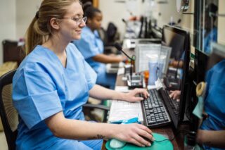 photo - Nurses Sitting in Reception at Healthcare Facility