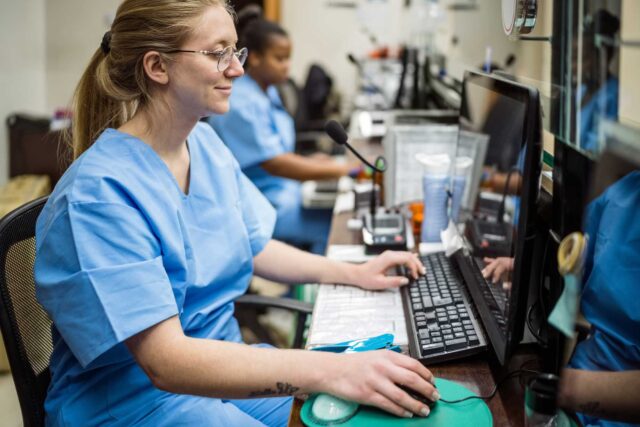 photo - Nurses Sitting in Reception at Healthcare Facility