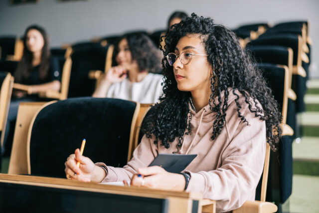 photo - College Student Listening to Lecture
