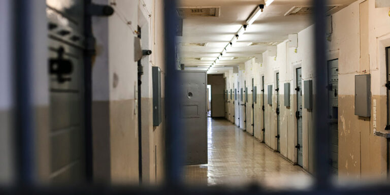 Photo - Long Hallway with Prison Cell Doors