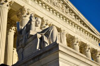 photo - Statue Outside the Supreme Court