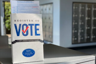 photo - Register To Vote Forms on Display at Post Office