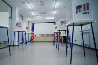photo - Voting Booths with American Flag Logo at Polling Station