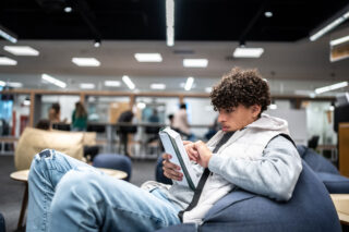 photo - Young University Student Man Reading a Book