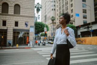 photo - Businesswoman Walking in Downtown Los Angeles
