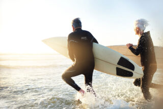 photo - Senior Married Couple Going Surfing
