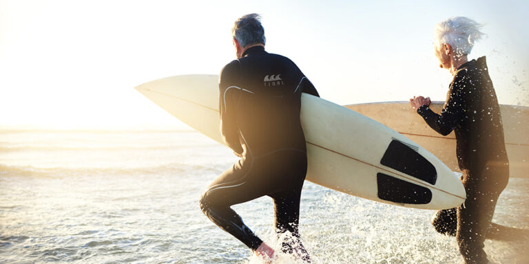 photo - Senior Married Couple Going Surfing
