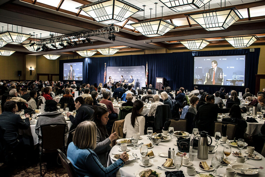 photo - The audience listens attentively to the speakers.