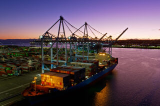 photo - Aerial shot of container ship in port of Los Angeles at twilight
