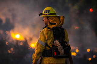 photo - Firefighter looking over brush fire at Sepulveda Basin