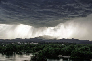 photo - Flooding water from heavy storm clouds in California