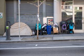 photo - Homeless Tent and Belongings on Sidewalk in San Francisco