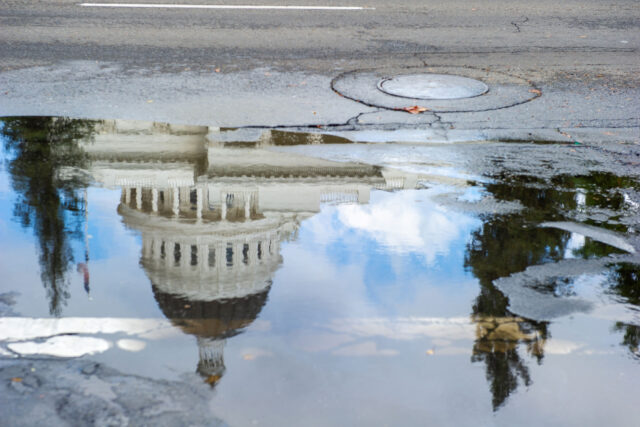 photo - Reflection of State Capitol Building in Flooded Street Puddle, pixel-ca-dwr-CC_weather_sac_0477_10_22_2012