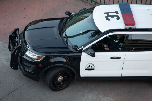 photo - Aerial View of Police Cruiser Parked on Street