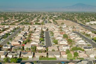 photo - Aerial View of Suburban Residential Streets in Bakersfield, California with Mountains in Background