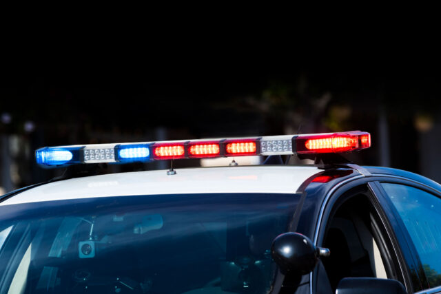 photo - Police Car with Lights on at Night