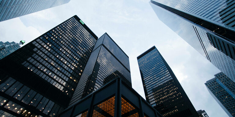 photo - Low Angle Photo of City High Rise Buildings During Daytime