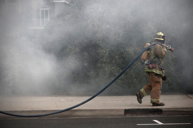 photo - Firefighter Caring Hose