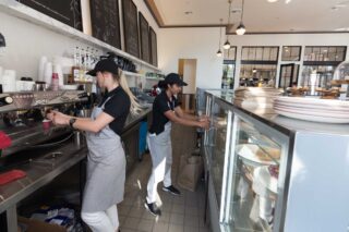 photo - Employees working behind the counter at restaurant in Santa Barbara, California