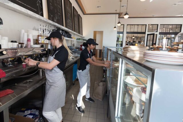 photo - Employees working behind the counter at restaurant in Santa Barbara, California