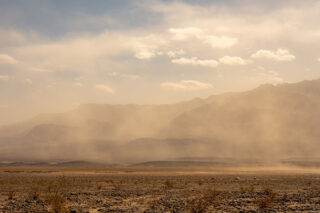 photo - Sandstorm at Devil's Cornfield in Death Valley