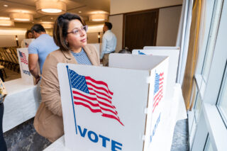 photo - Woman Voting in an Election