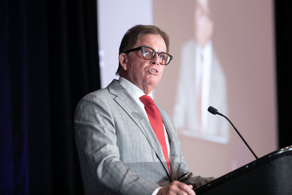 photo - Rusty Areias welcomes the audience