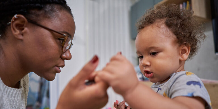 photo - Baby Boy Holding Mother's Hand