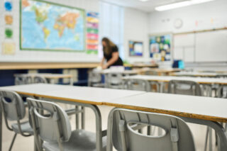 photo - School Teacher Preparing a Lesson before Students Arrive