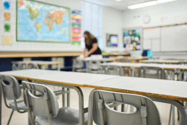 photo - School Teacher Preparing a Lesson before Students Arrive