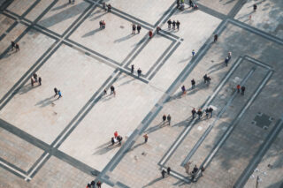 photo - People standing in sections on pavement