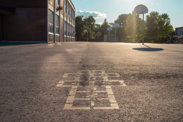photo - School Building and School Yard in the Evening