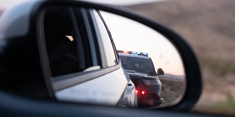 photo - Police Traffic Stop in Rear View Mirror