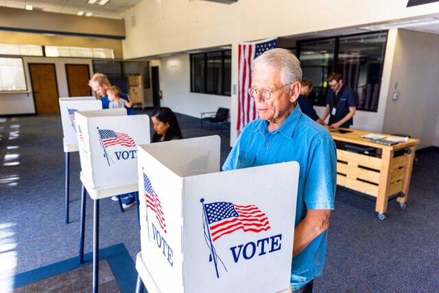 photo - Voters at Polling Booths on Sunny Day