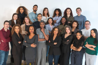photo - Group of Diverse and Serious People Looking at the Camera