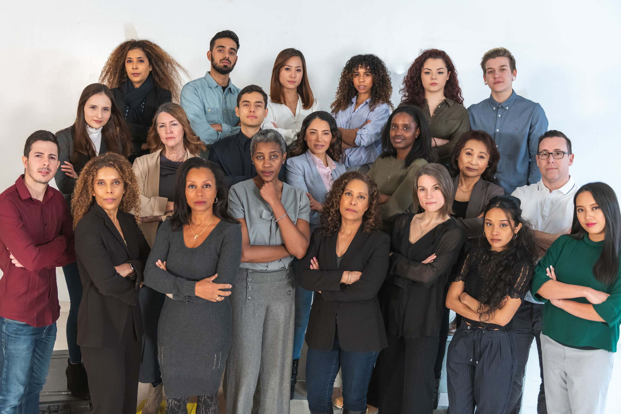 photo - Group of Diverse and Serious People Looking at the Camera
