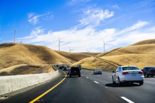 photo - Cars heading towards Altamont Pass in East San Francisco Bay Area with Wind Turbines Visible on Dry Grass Hills