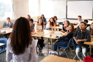 photo - High School Students in Classroom and Listening to Teacher