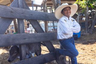 photo - Portrait of a Boy in a Ranch Hat Looking at the Camera
