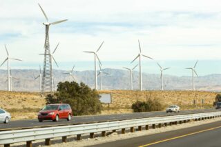 photo - Windmills and Cars on Highway in Desert Hot Springs, California