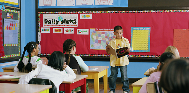 photo of child reading in classroom