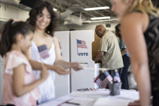 photo - Man at Voting Booth