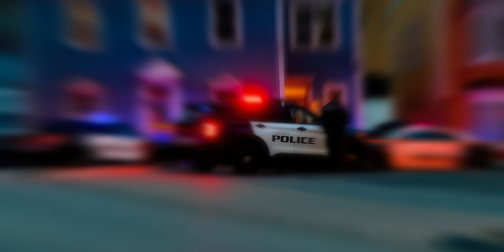 photo - Blur Background of Police Cars at Night