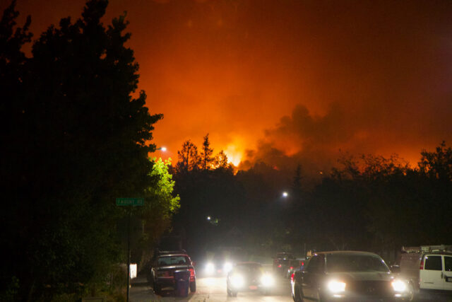 photo - Cars Evacuating from Forest Fire in Shiloh Regional Park at Night