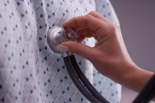 photo - Closeup of stethoscope on patient's chest