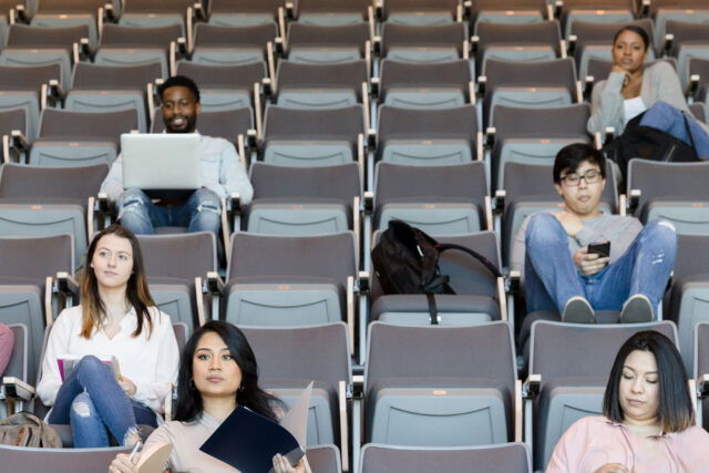 photo - College Students in a Partially Empty Classroom
