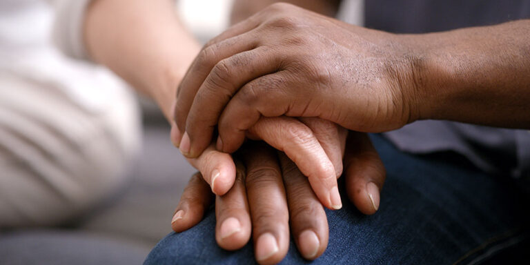 photo - Couple Holding Hands for Support and Help